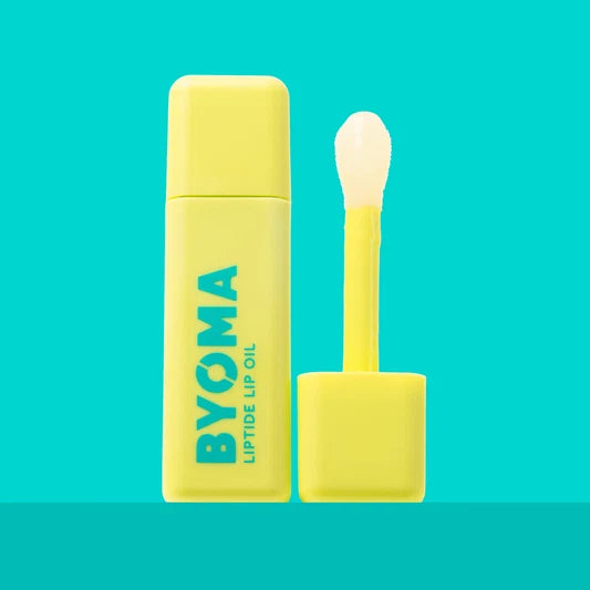 Un flacon de BYOMA Liptide Lip Oil avec son applicateur retiré.