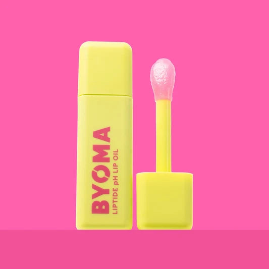 Un flacon de BYOMA Liptide pH Lip Oil avec son applicateur retiré.