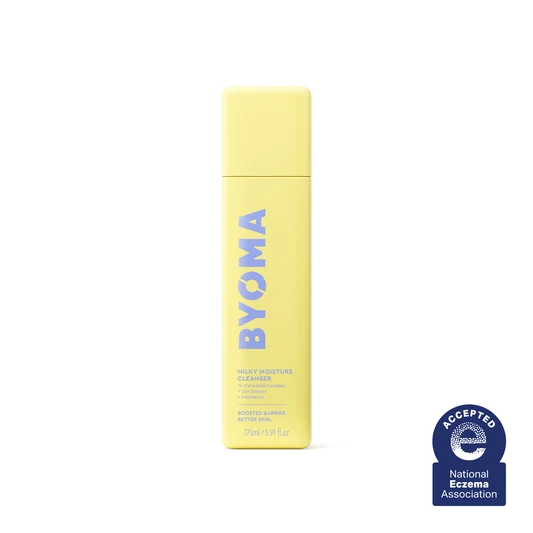 Un flacon jaune de Byoma Milky Moisture Cleanser avec le sceau de la National Eczema Association.